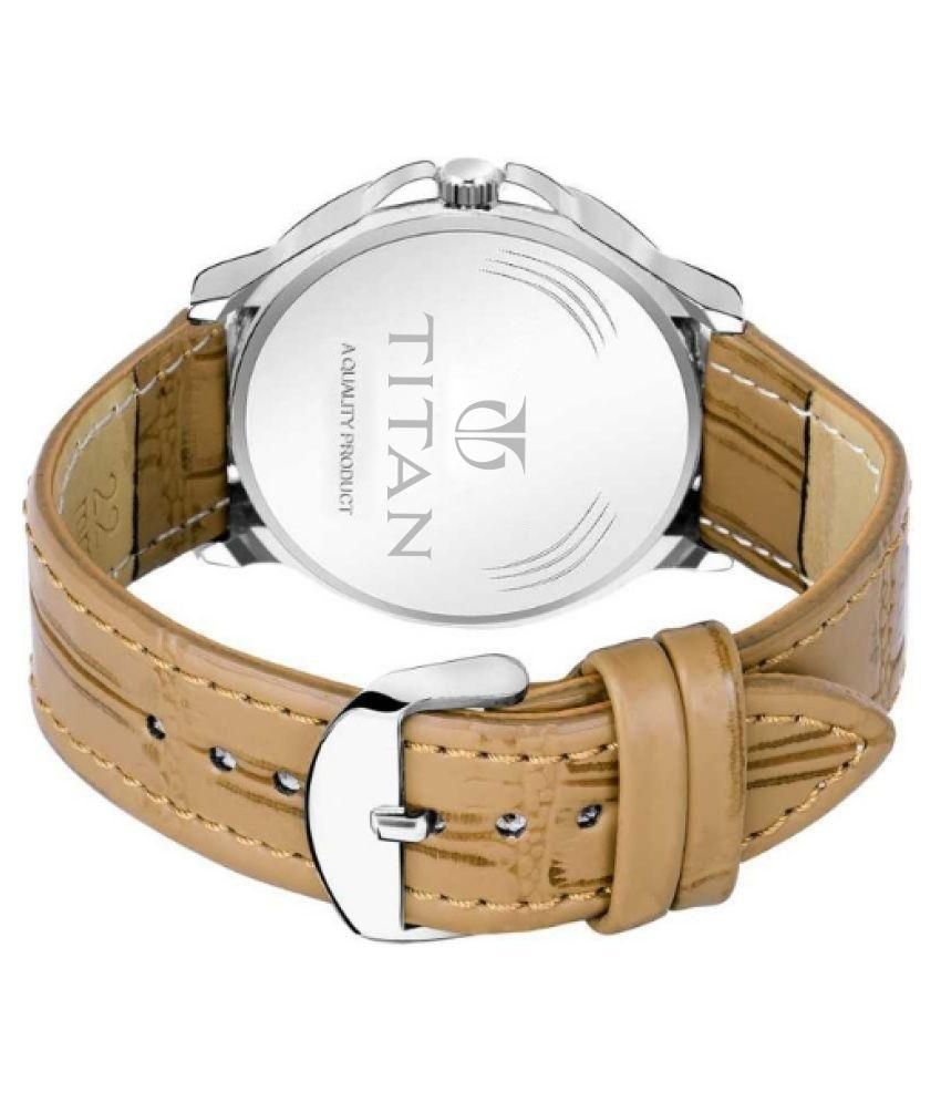 Titan watch with beige strap and silver case on a white background