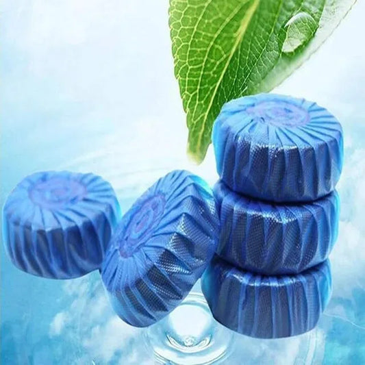 Blue laundry detergent pods with a green leaf on a water background