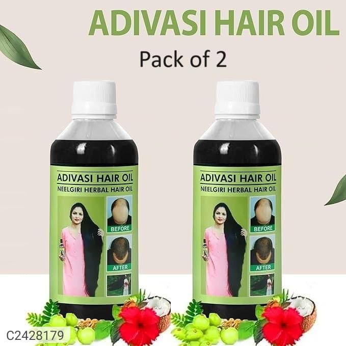Two bottles of Adivasi Hair Oil with green labels and decorative elements on a beige background.