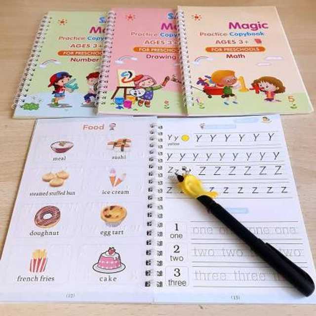 Educational books for preschoolers with a pen on a wooden surface