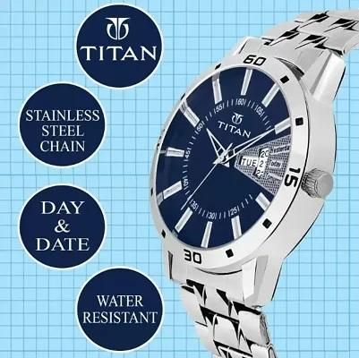Titan watch with blue dial and stainless steel chain on a blue grid background