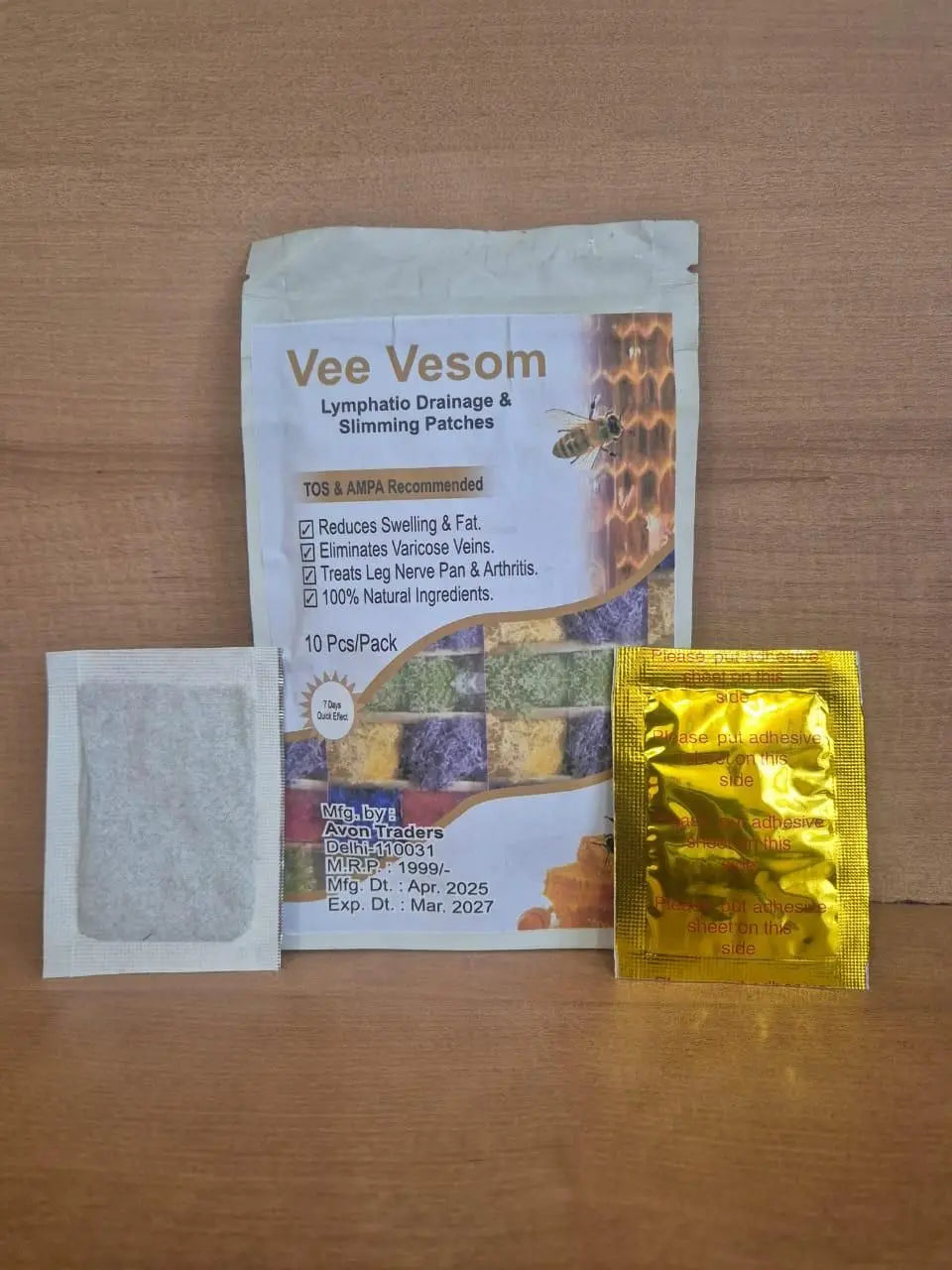 Vee Vesom lymphatic drainage and slimming patches on a wooden surface