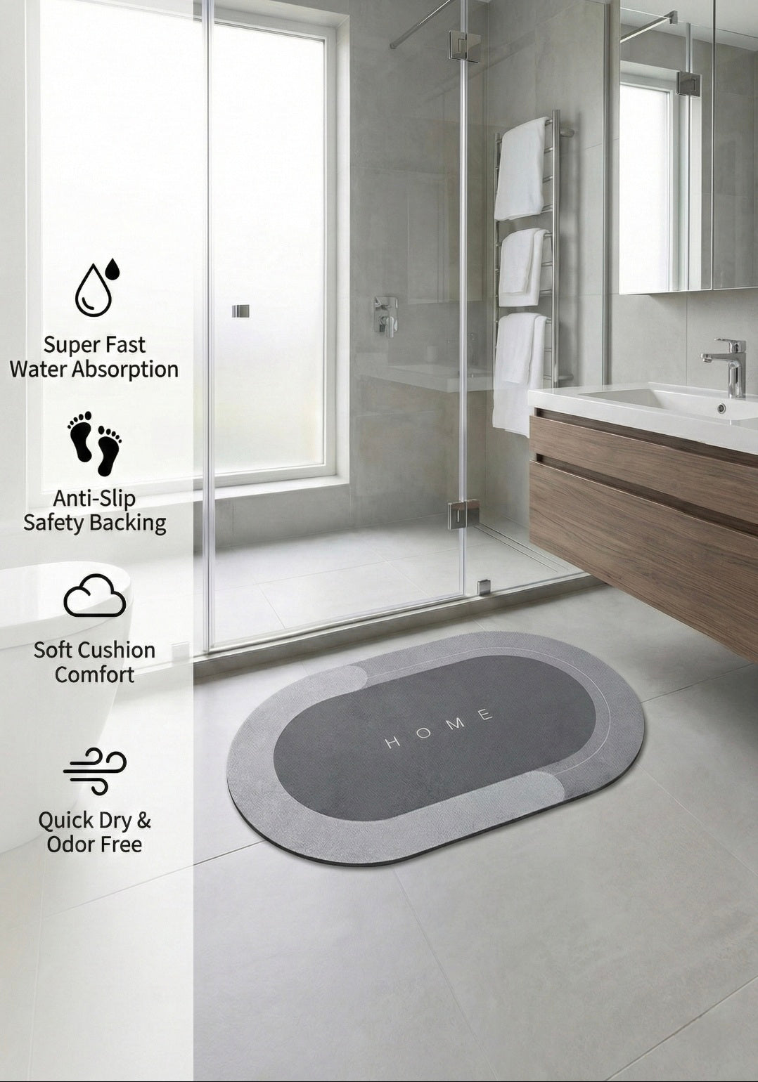 Gray bath mat with 'HOME' branding on a bathroom floor, featuring product benefits text.