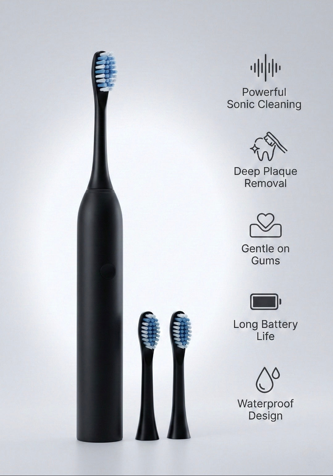 Black electric toothbrush with attachments on a gray background
