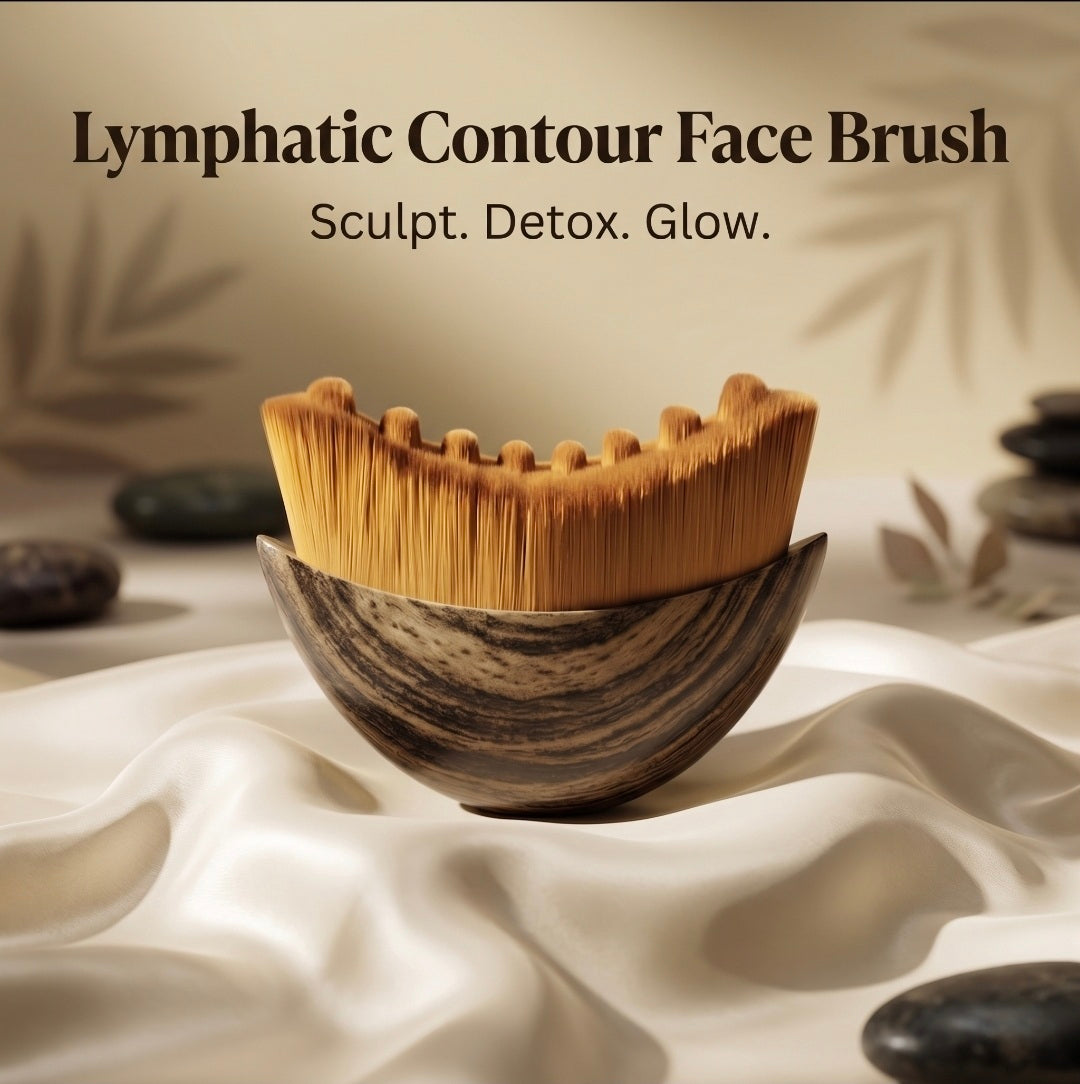 Lymphatic contour face brush with a wooden handle on a white fabric background.