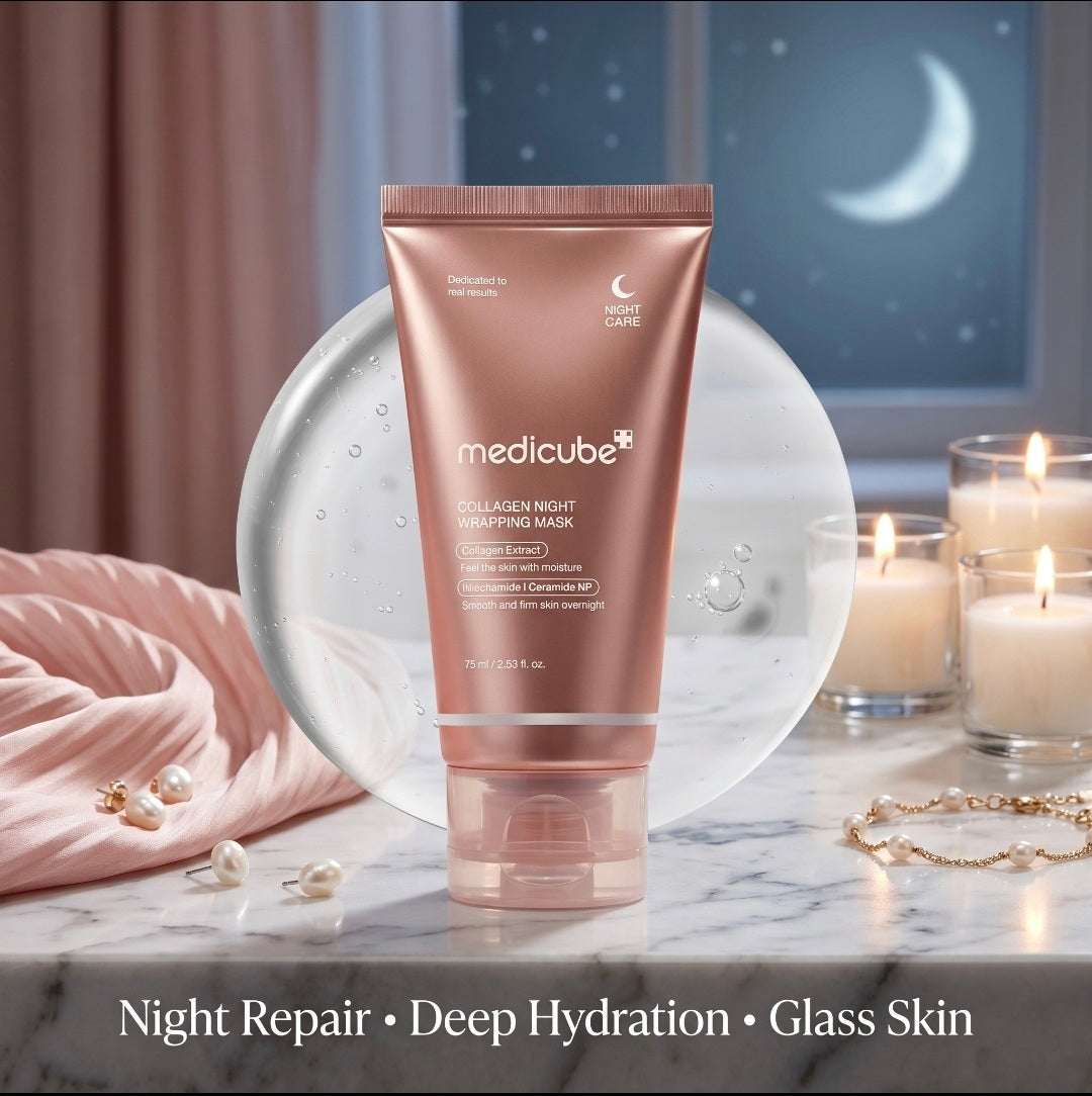 Medicube collagen night wrapping mask on a marble surface with candles and jewelry in the background