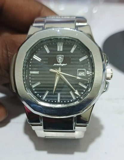 Silver watch with black dial on a white background