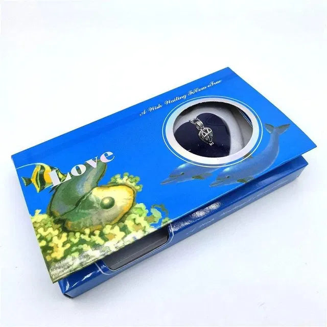 Blue jewelry box with fish design on a white background