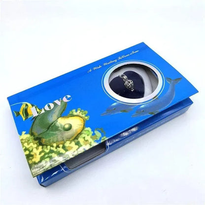 Blue jewelry box with fish design on a white background